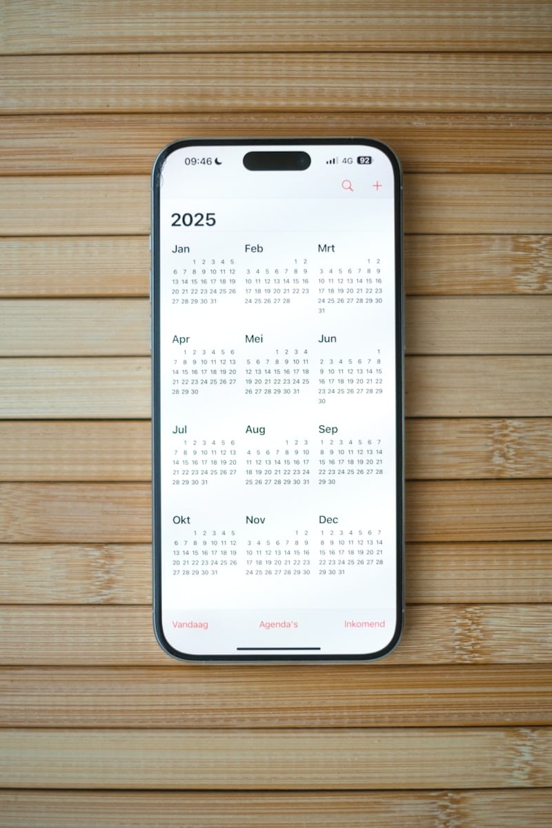 A white calendar on a wooden surface